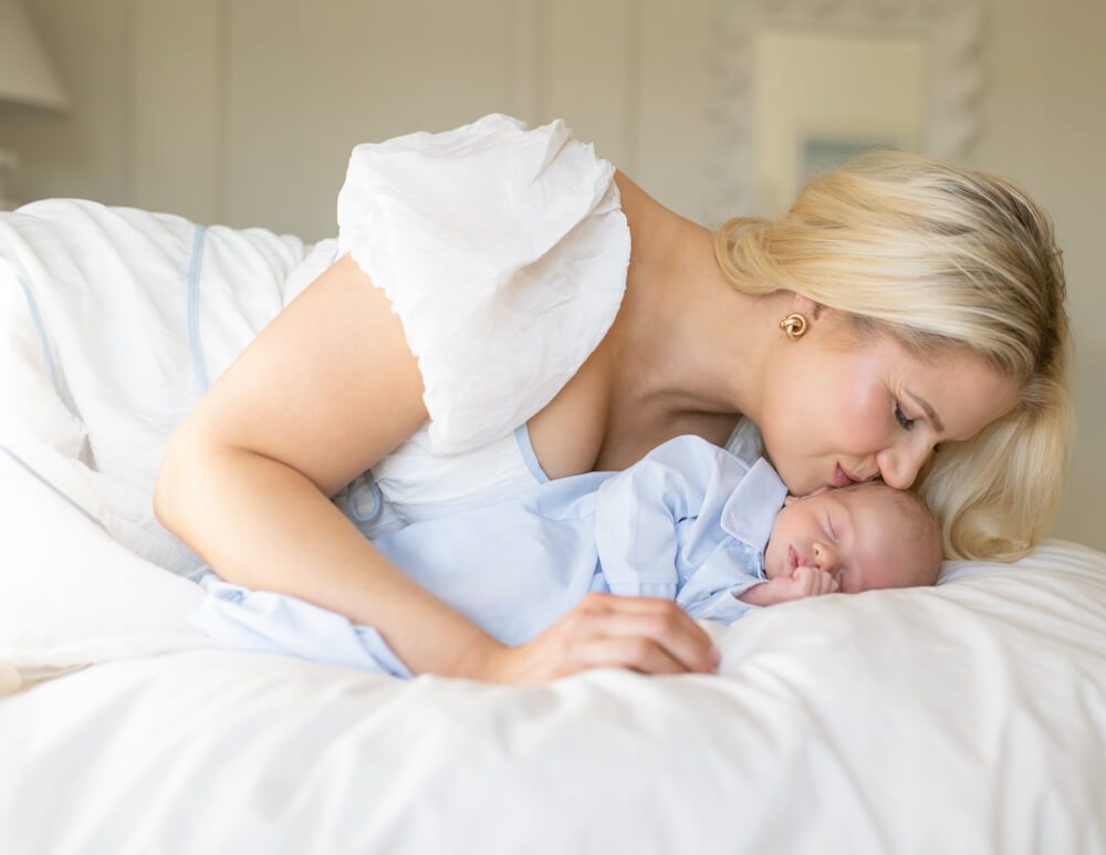 mom kissing her baby in her house in parker
