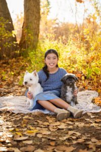 girl and her puppies