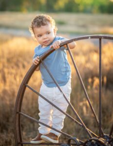 boy playing at a park with cute clothes from baby stores in denver