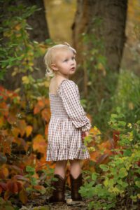 little girl curious about fall colors in denver