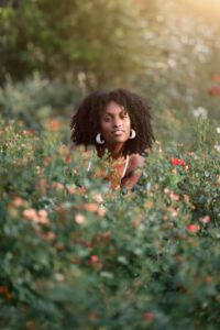 girl among beautiful flowers