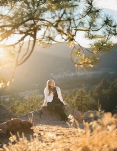 girl sitting on a rock