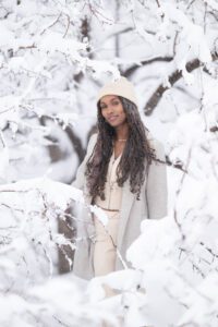 girl poses by a tree